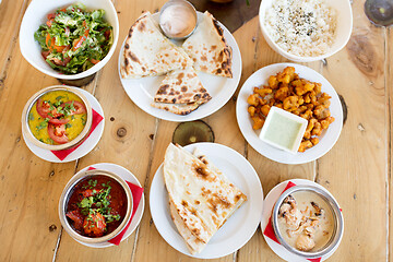 Image showing various food on table of indian restaurant