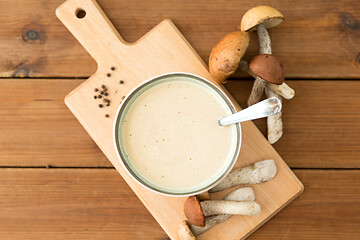 Image showing mushroom cream soup in bowl on cutting board