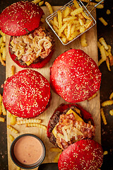 Image showing Burgers near sauce and french fries