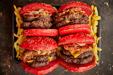 Image showing Burgers placed on french fries