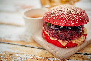 Image showing Beetroot burger on shabby table