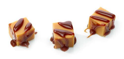 Image showing caramel candies with chocolate sauce