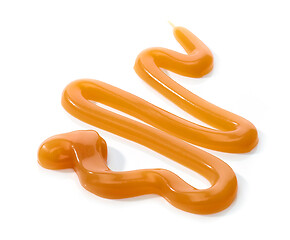 Image showing melted caramel on white background