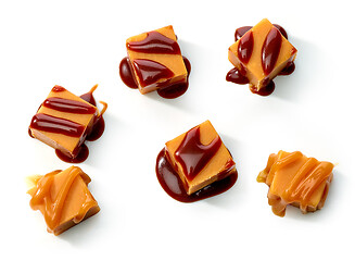 Image showing caramel candies with melted sauce