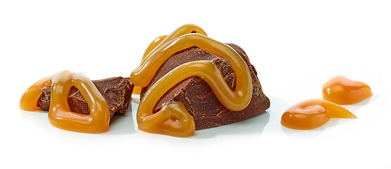 Image showing chocolate pieces with melted caramel sauce