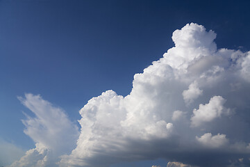 Image showing Big white fluffy cloud on blue sky