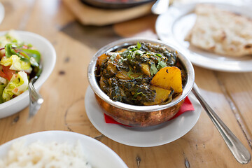 Image showing close up of aloo palak dish in bowl on table