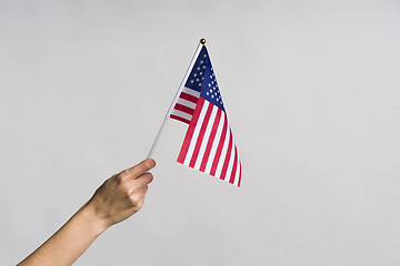 Image showing Human hand holding USA flag