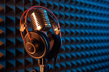 Image showing Studio condenser microphone with professional headphones acoustic panel