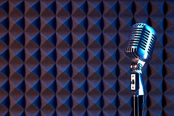 Image showing Studio retro condenser microphone on acoustic foam panel