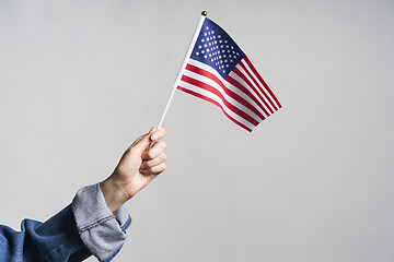 Image showing Human hand holding USA flag