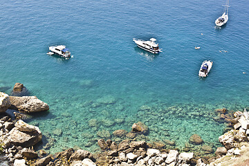 Image showing View of the Tremiti Islands. Boats near a rock stone coast.