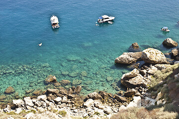 Image showing View of the Tremiti Islands. Boats near a rock stone coast.