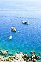 Image showing View of the Tremiti Islands. Boats near a rock stone coast.