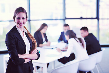 Image showing business woman with her staff in background at office