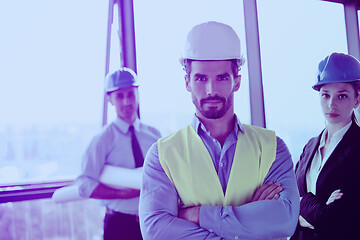 Image showing business people and construction engineers on meeting