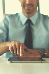 Image showing business man using tablet compuer at office