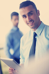 Image showing business man using tablet compuer at office