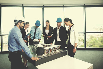 Image showing business people and engineers on meeting