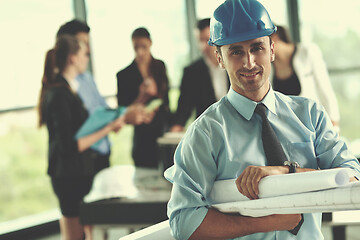 Image showing business people and construction engineers on meeting