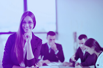 Image showing business woman with her staff in background at office