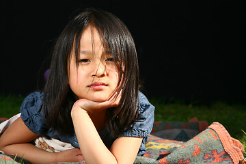 Image showing Portrait of a young cute girl looking at the camera