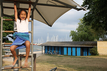 Image showing Portrait of a young cute girl on a playing field