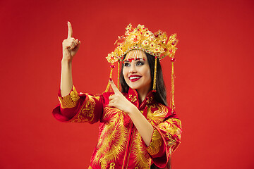 Image showing Chinese traditional woman. Beautiful young girl wearing in national costume