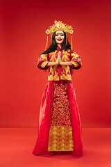 Image showing Chinese traditional woman. Beautiful young girl wearing in national costume