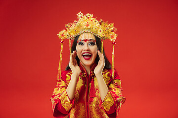 Image showing Chinese traditional woman. Beautiful young girl wearing in national costume