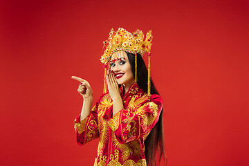 Image showing Chinese traditional woman. Beautiful young girl wearing in national costume