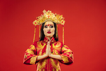 Image showing Chinese traditional woman. Beautiful young girl wearing in national costume