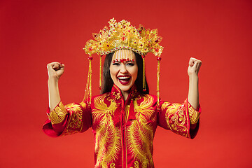 Image showing Chinese traditional woman. Beautiful young girl wearing in national costume