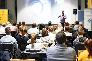 Image showing Business speaker giving a talk at business conference event.