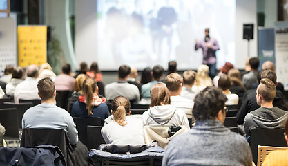 Image showing Business speaker giving a talk at business conference event.