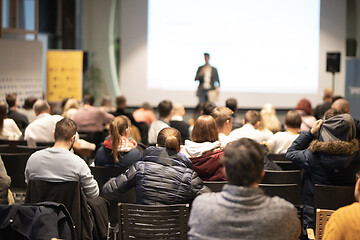 Image showing Business speaker giving a talk at business conference event.