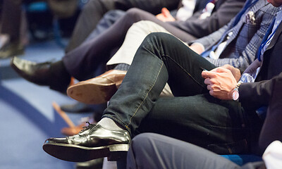 Image showing Row of business people sitting at seminar.