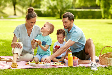 Image showing happy family having picnic at summer park