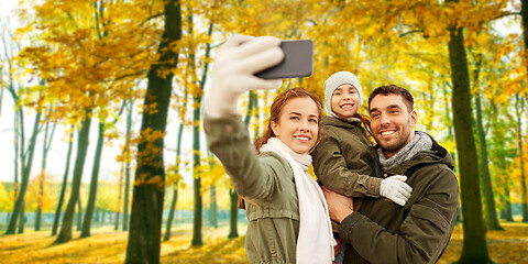 Image showing family taking selfie by smartphone in autumn park