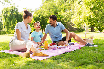 Image showing happy family having picnic at summer park