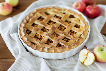 Image showing close up of apple pie in baking mold on towel