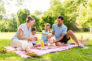 Image showing happy family having picnic at summer park