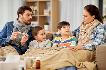 Image showing family with ill children having fever at home