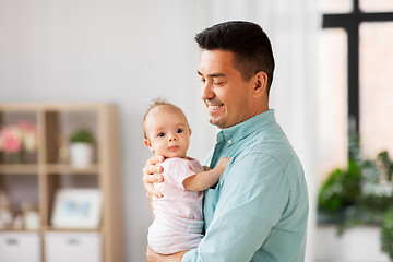 Image showing middle aged father with baby daughter at home