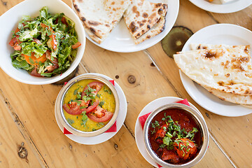 Image showing various food on table of indian restaurant