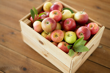 Image showing ripe apples in wooden box on table