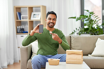 Image showing indian man using smartphone for food delivery