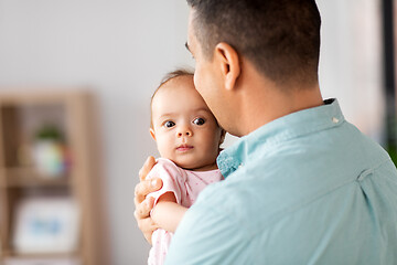 Image showing middle aged father with baby daughter at home