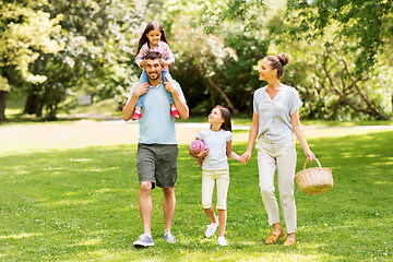 Image showing family with picnic basket walking in summer park