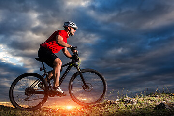 Image showing Mountain Bike cyclist riding single track